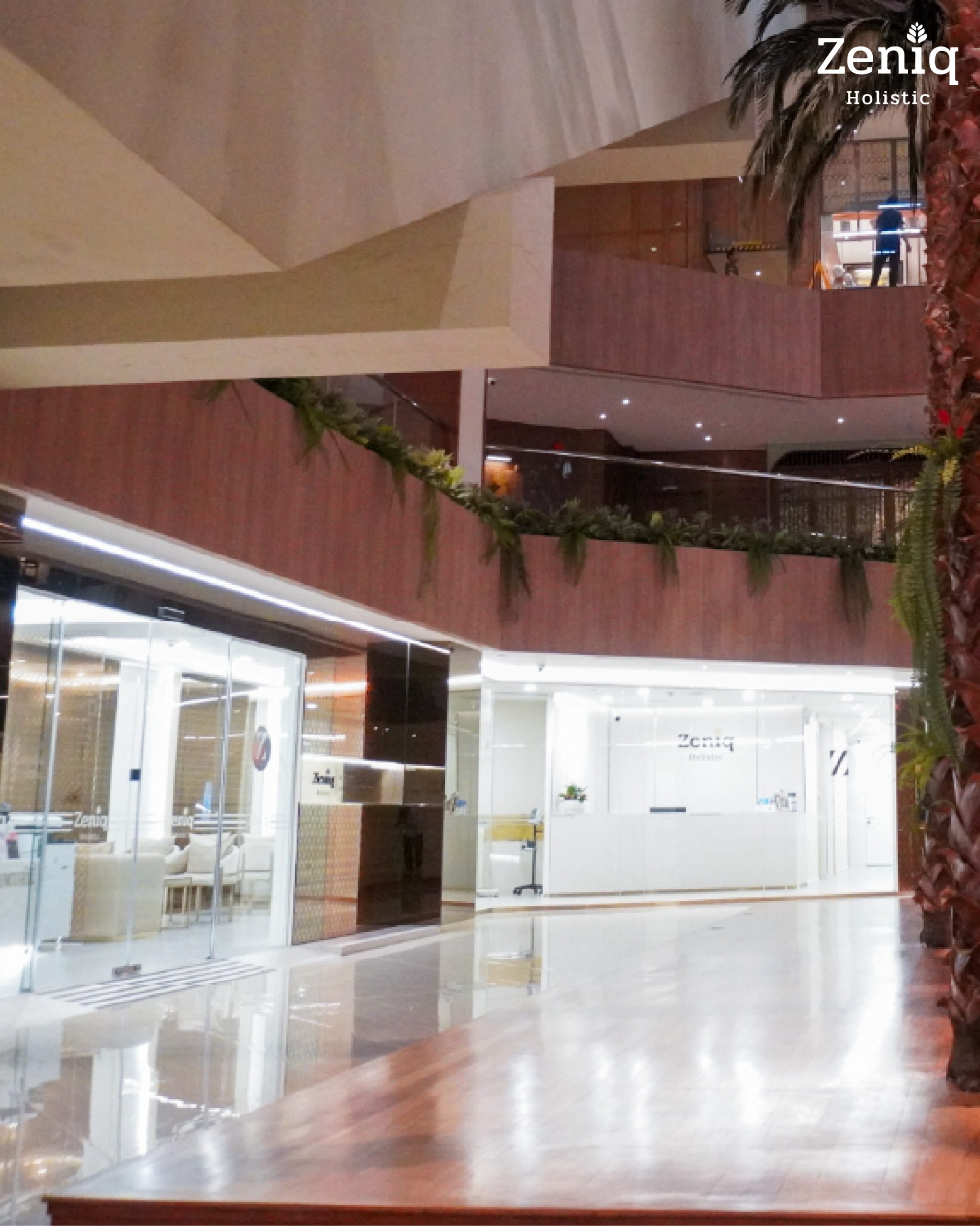 Spacious and luxurious interior hallway leading to the Zeniq Holistic Clinic.