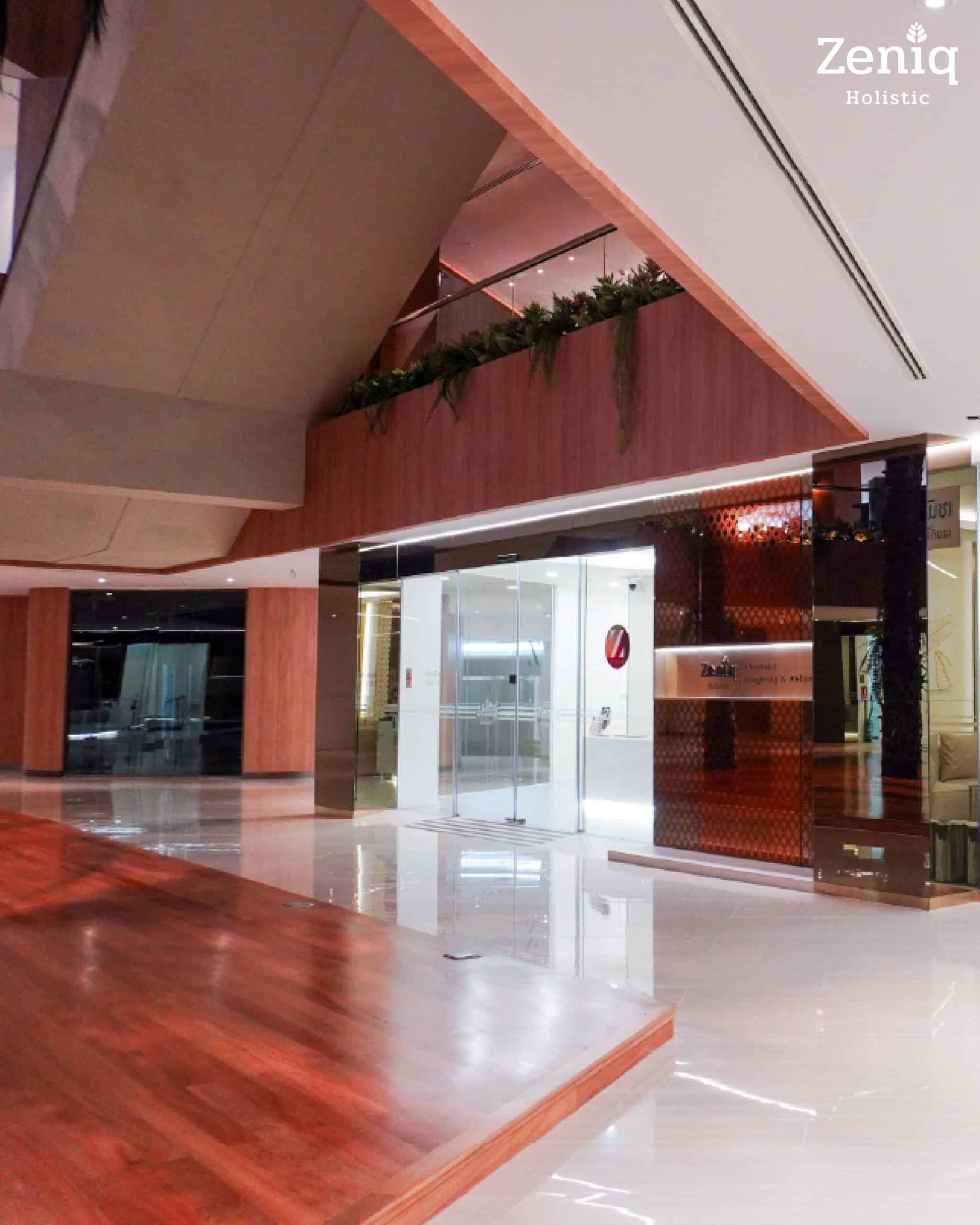 Exterior entrance and storefront of Zeniq Holistic Clinic located in the wellness center.